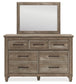 Yarbeck Queen Panel Bed with Storage with Mirrored Dresser and Chest